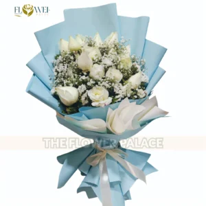 Elegant fresh white rose bouquet in premium black wrapping available for delivery in Islamabad