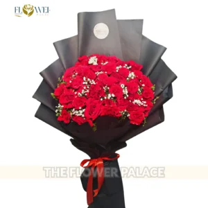 Luxury mixed bouquet featuring sunflowers and roses with premium blue wrapping.