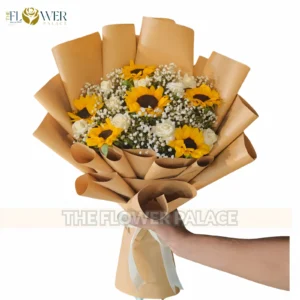 Large vibrant Sunflower bouquet wrapped in premium black and gold paper for delivery in Rawalpindi.