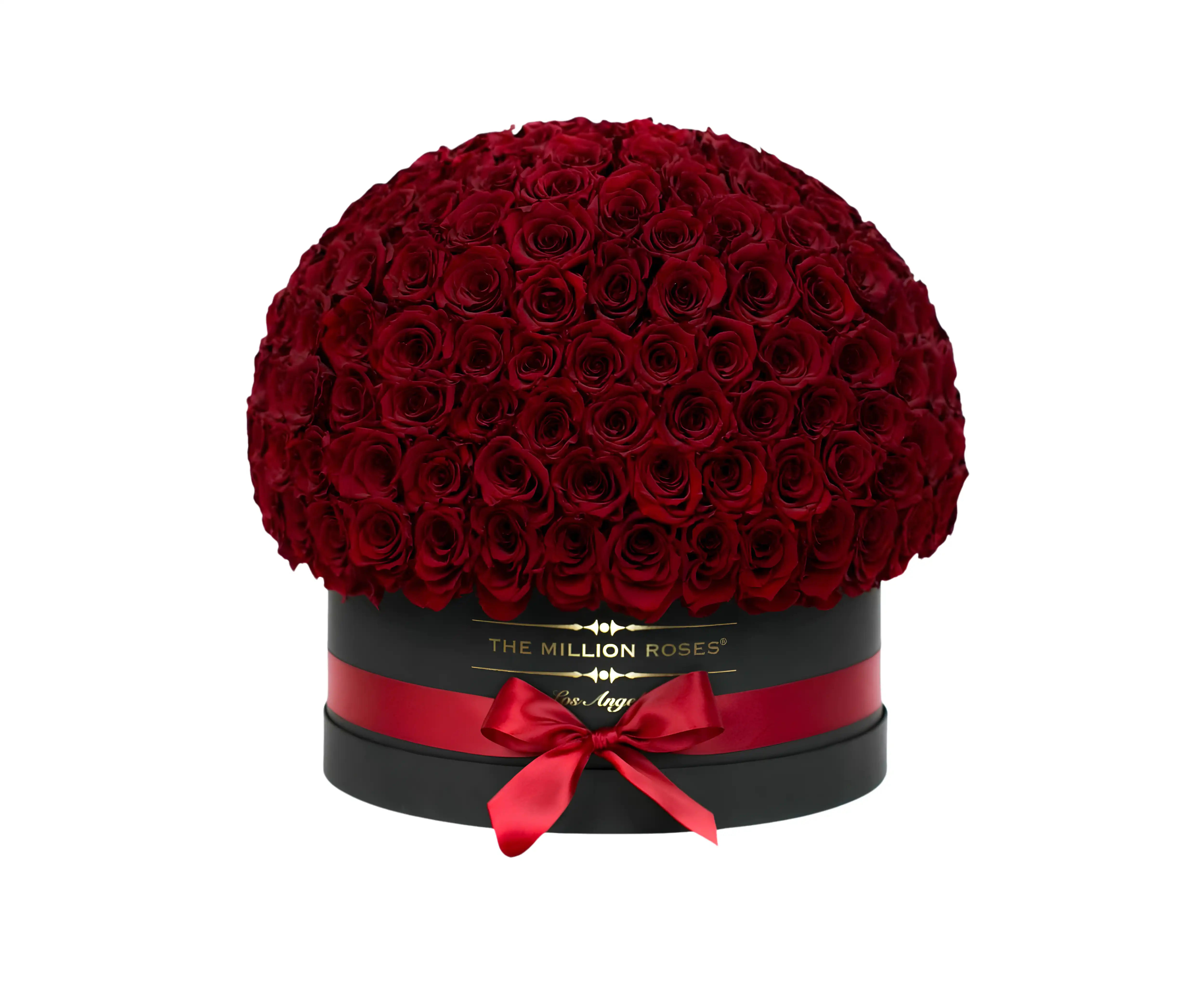 A round black box filled with numerous red roses, decorated with a red ribbon and labeled “500 Roses.”.