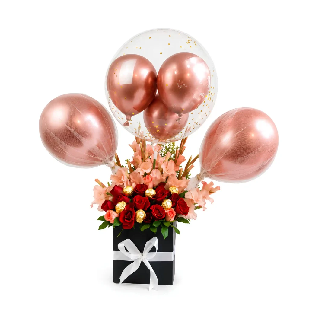 A box containing a vibrant bouquet of roses alongside colorful balloons, perfect for a celebratory occasion.