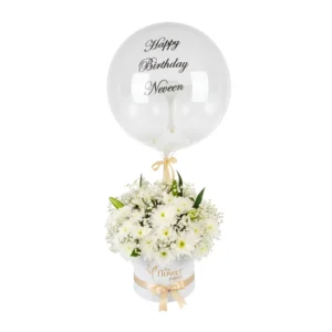 A bouquet of colorful birthday balloons surrounded by white daisies, creating a festive and cheerful atmosphere.