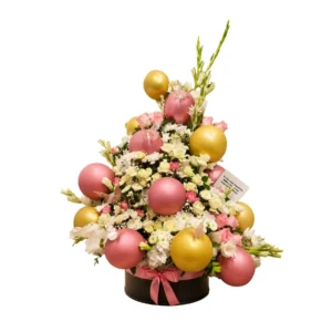 A decorated Christmas tree adorned with colorful ornaments and vibrant flowers, creating a festive holiday atmosphere.