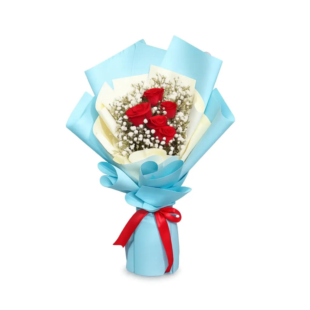 A vibrant bouquet featuring red roses surrounded by delicate white baby's breath flowers.