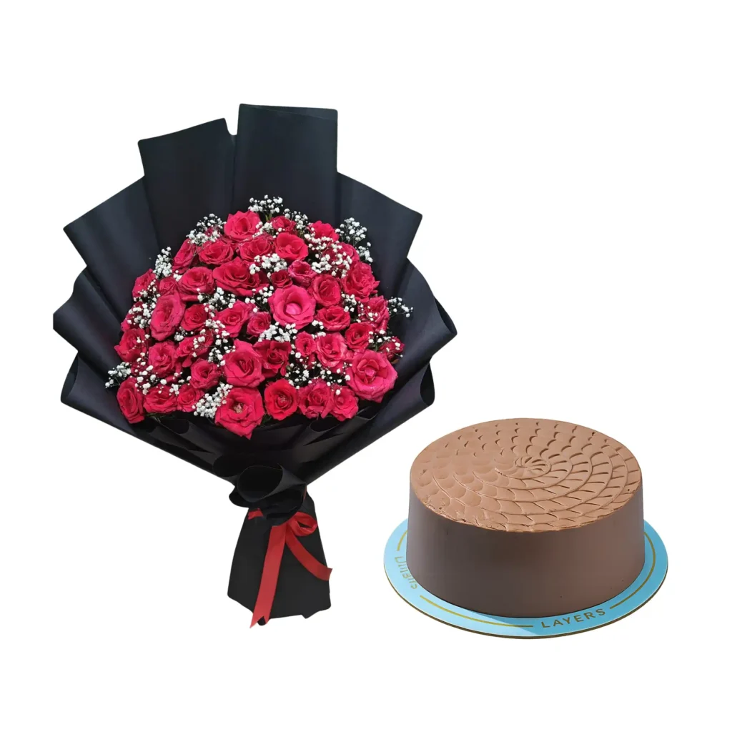 A vibrant bouquet of roses beside a rich chocolate cake, creating a festive and romantic atmosphere.