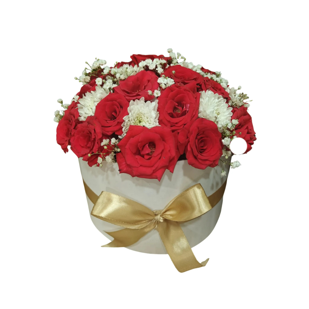 A white box filled with vibrant red roses and delicate white chrysanthemums arranged elegantly.