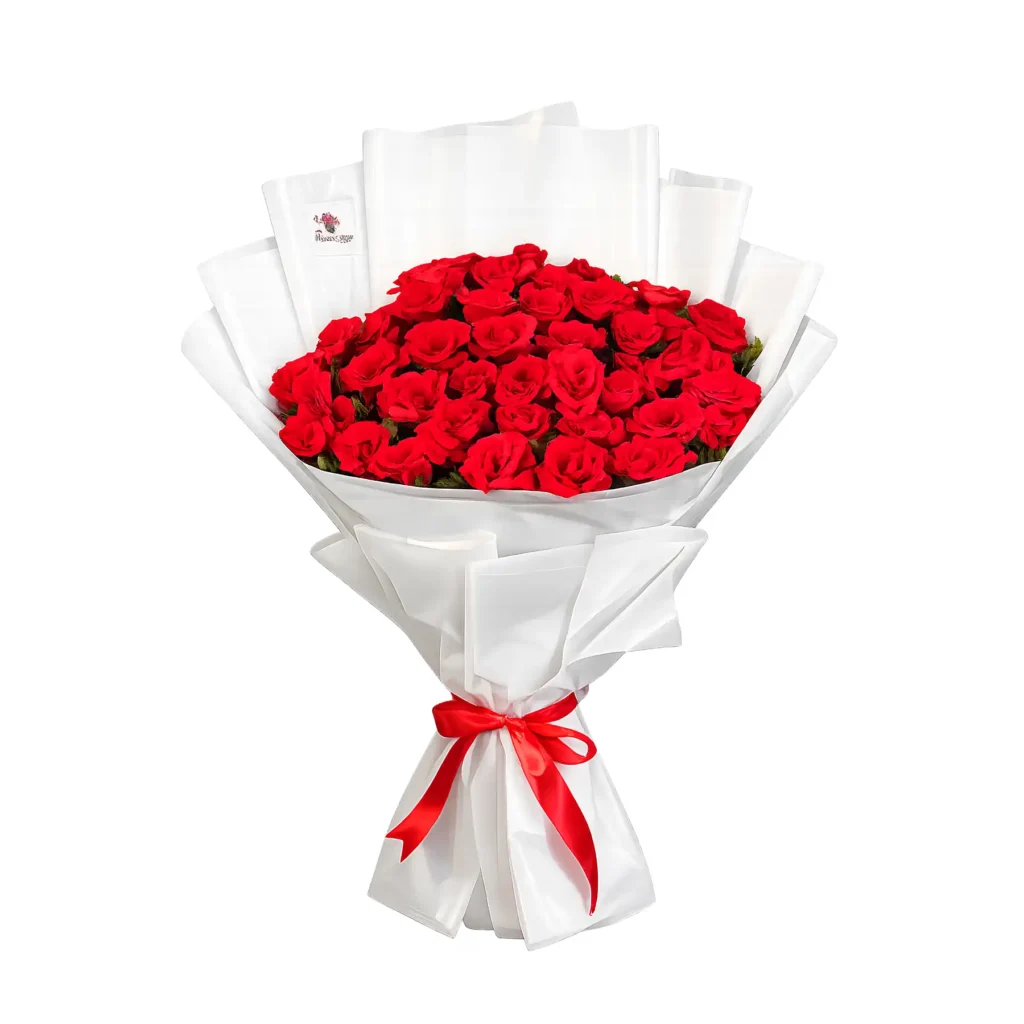 A bouquet of vibrant red roses tied with a red ribbon, elegantly arranged for a special occasion.