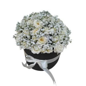 Black hat box with white flowers and gysophila arrangements