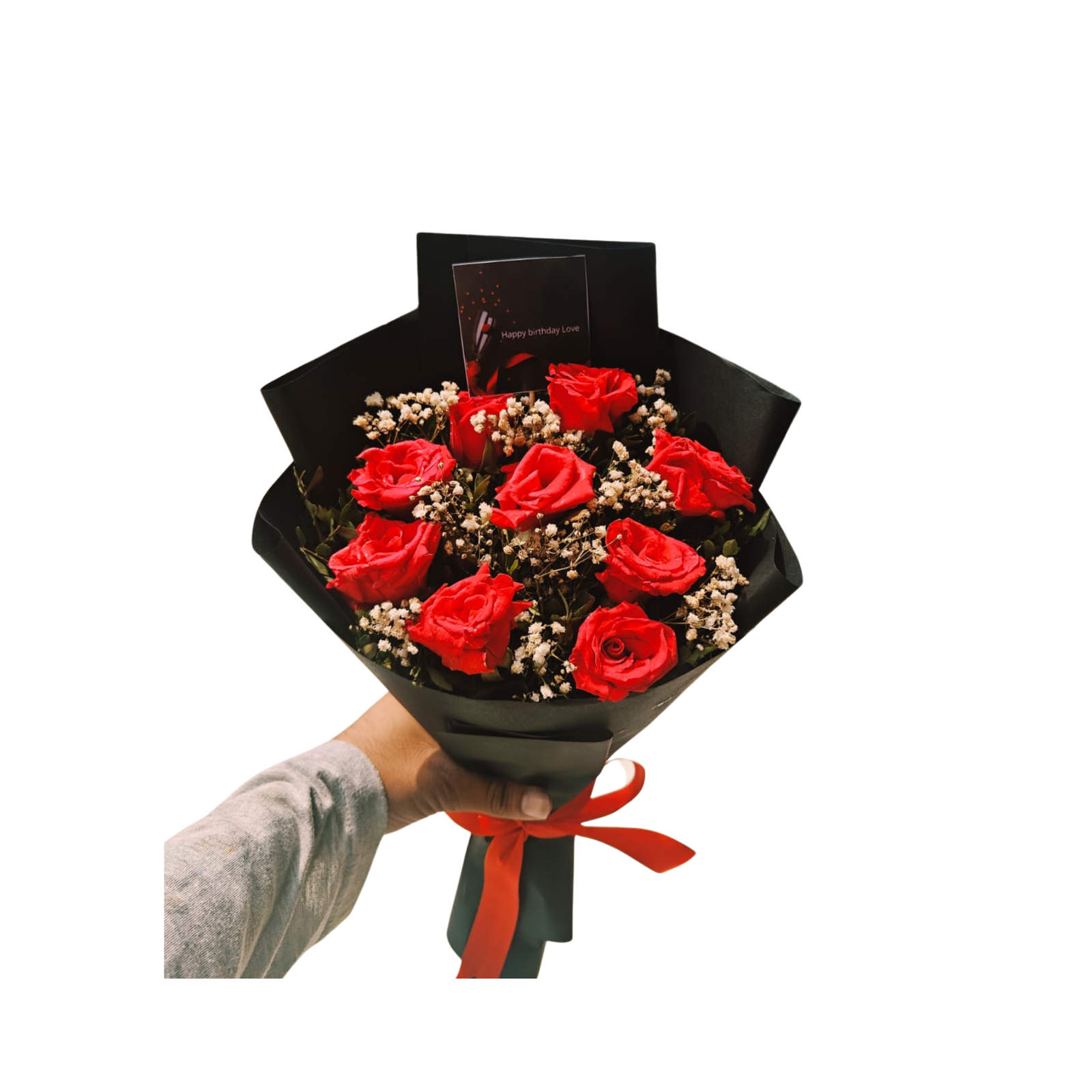 A bouquet of vibrant red roses arranged in an elegant black box.